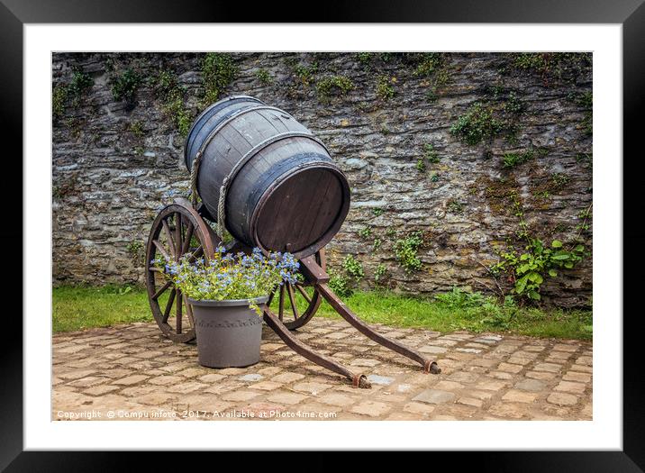 old wine barrel with wheels  Framed Mounted Print by Chris Willemsen