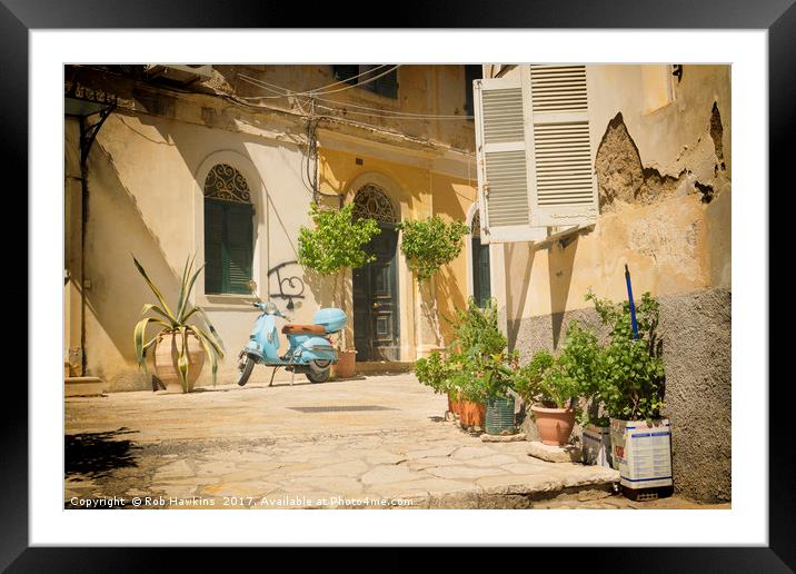 Corfu Street Scooter  Framed Mounted Print by Rob Hawkins