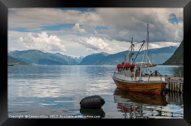 fishing boat in the harbor of Vik Framed Print by Chris Willemsen