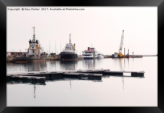 pilot boats against a harbor wall  Framed Print by Gary Parker