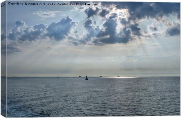  Sun-rays on the Solent. Canvas Print by Angela Aird