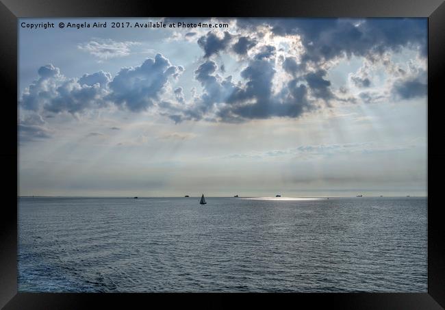  Sun-rays on the Solent. Framed Print by Angela Aird
