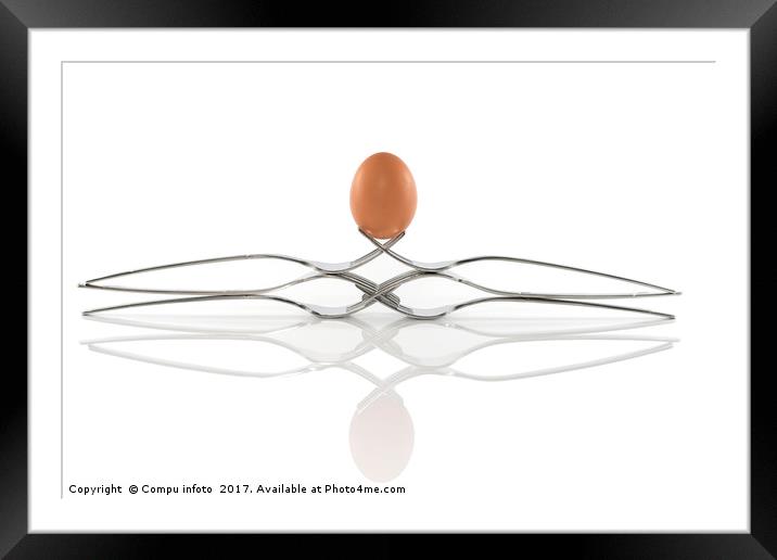 egg balance on six forks Framed Mounted Print by Chris Willemsen