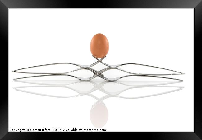 egg balance on six forks Framed Print by Chris Willemsen