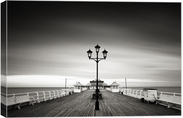 End of the Day - Cromer Pier Canvas Print by Simon Wrigglesworth