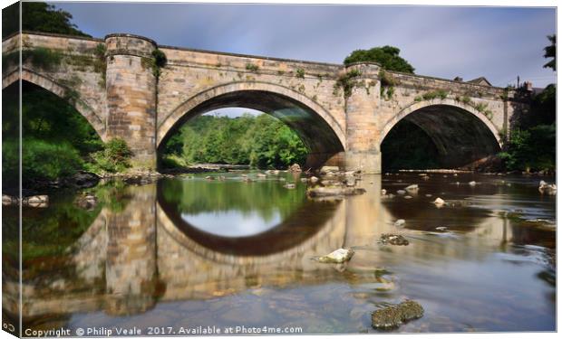 Richmond Bridge Reflection in River Swale. Canvas Print by Philip Veale
