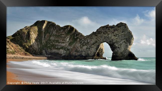 Durdle Door on an Incoming Tide. Framed Print by Philip Veale