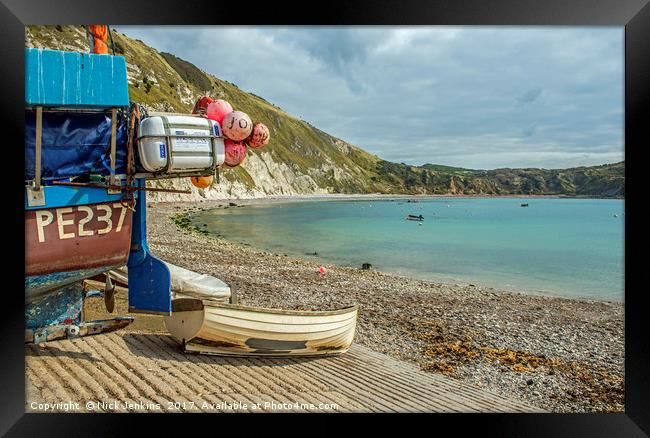 Lulworth Cove and boats on the Dorset coast Framed Print by Nick Jenkins
