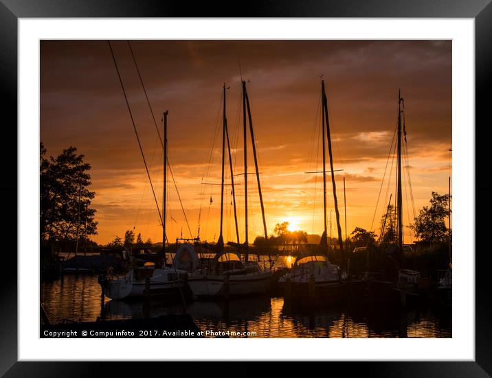 sunset in the harbor of de veenhoop in holland Framed Mounted Print by Chris Willemsen