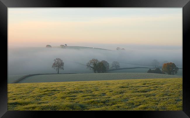 Hill tops in the mist Framed Print by Pete Hemington