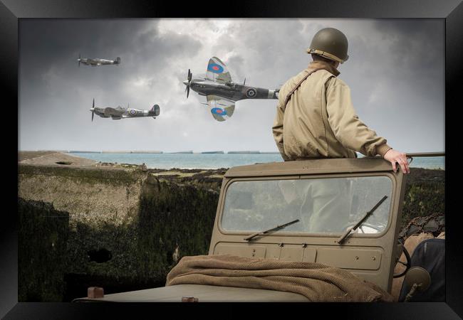 American GI on Normandy beach watches Spitfires Framed Print by George Cairns