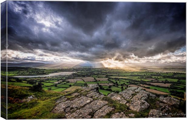 Sun's rays over the Brecon Beacons Canvas Print by Karl McCarthy