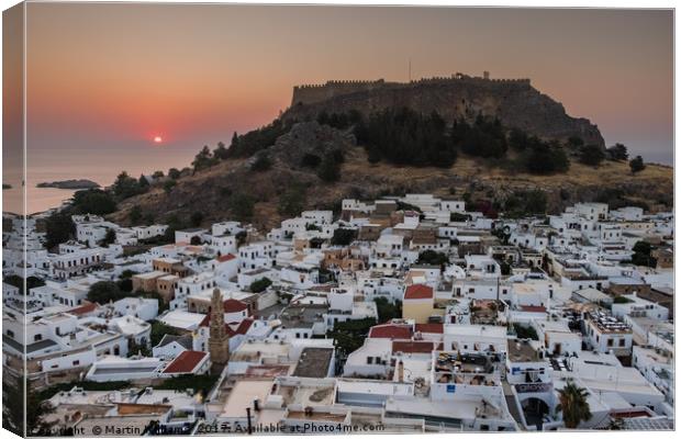 Sunrise over Lindos town, Rhodes, Greece Canvas Print by Martin Williams