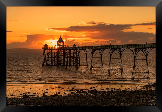 Sun setting at Clevedon Pier Framed Print by Dean Merry