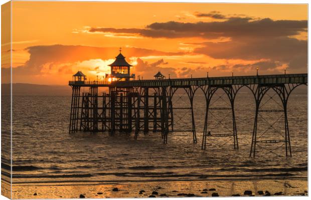 Sun setting at Clevedon Pier Canvas Print by Dean Merry
