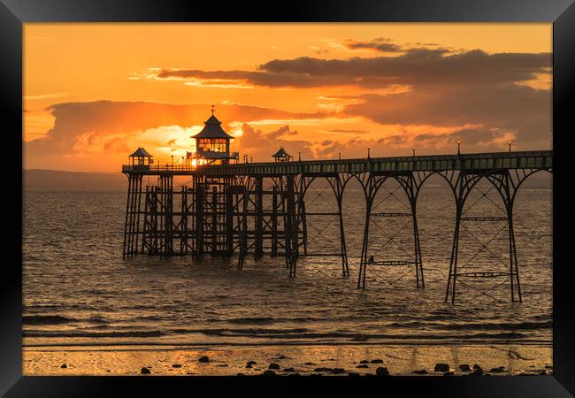 Sun setting at Clevedon Pier Framed Print by Dean Merry