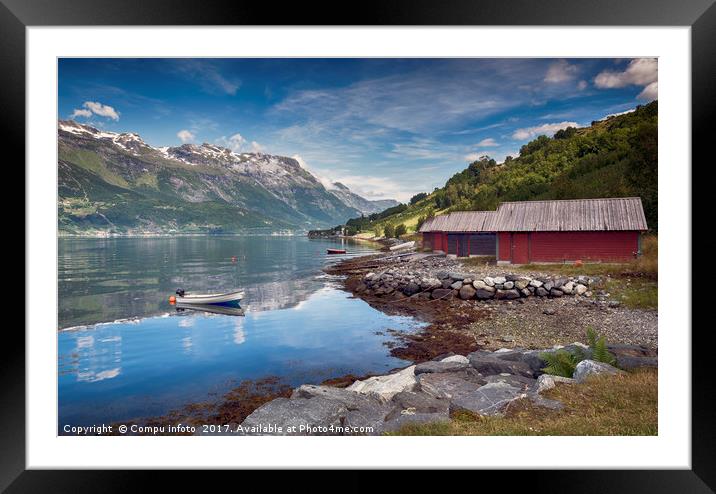 red houses and a boat in the fjord in norway Framed Mounted Print by Chris Willemsen