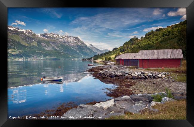 red houses and a boat in the fjord in norway Framed Print by Chris Willemsen