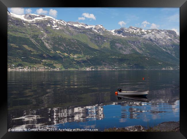 a boat in the fjord in norway Framed Print by Chris Willemsen