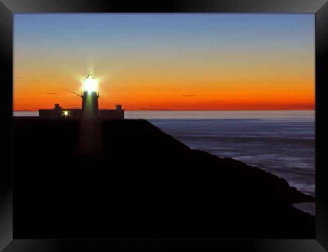 Strumble Head Lighthouse Silhouette. Fishguard. Framed Print by paulette hurley