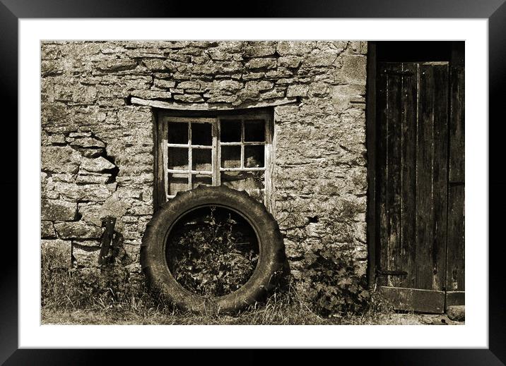 Old tractor wheel. Framed Mounted Print by Andrew chittock