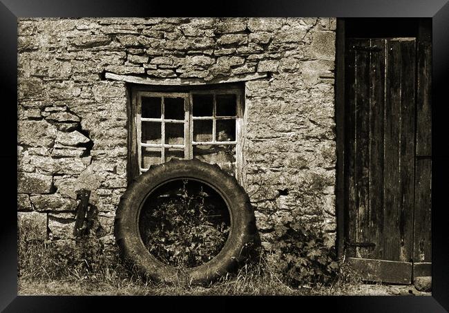 Old tractor wheel. Framed Print by Andrew chittock