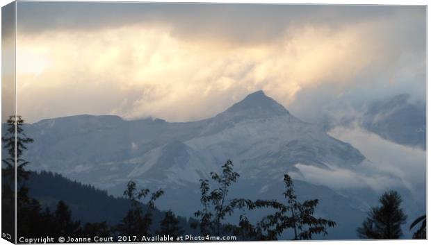 Swiss Alps in the early evening. Canvas Print by Joanne Court