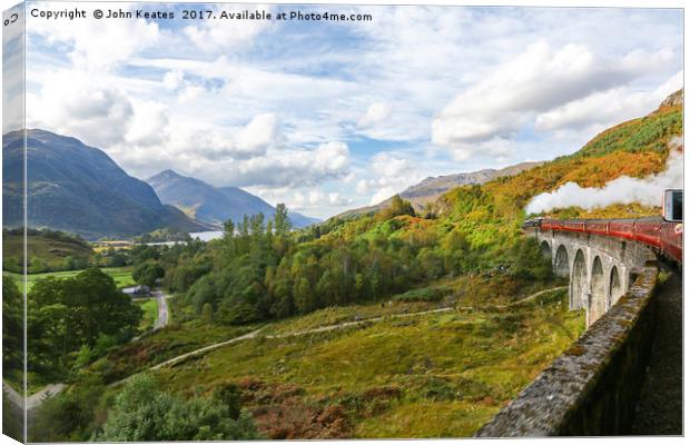 A steam engine going over the Glenfinnan Viaduct  Canvas Print by John Keates