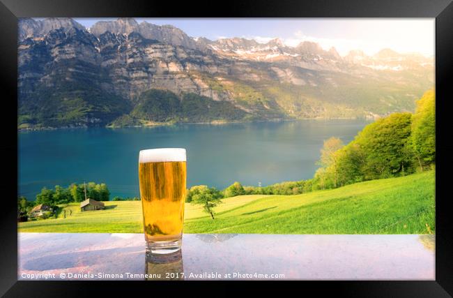 Glass of beer in a summer alpine scenery Framed Print by Daniela Simona Temneanu