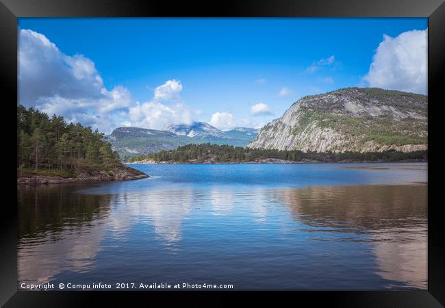 mountains and fjord in norway Framed Print by Chris Willemsen