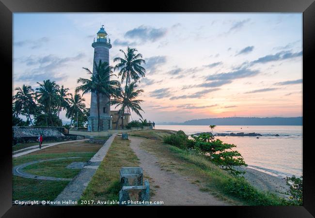 Galle fort lighthouse at sunrise Framed Print by Kevin Hellon
