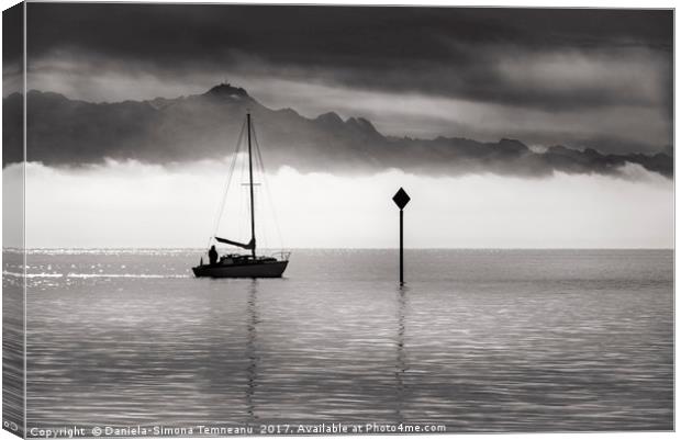 Monochrome image of a single boat sailing Canvas Print by Daniela Simona Temneanu
