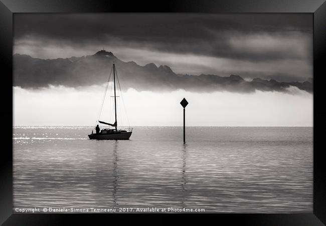 Monochrome image of a single boat sailing Framed Print by Daniela Simona Temneanu