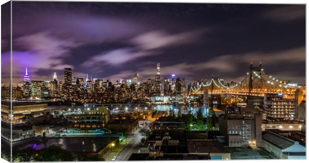 Manhattan Skyline at Night Canvas Print by Paul Mirfin