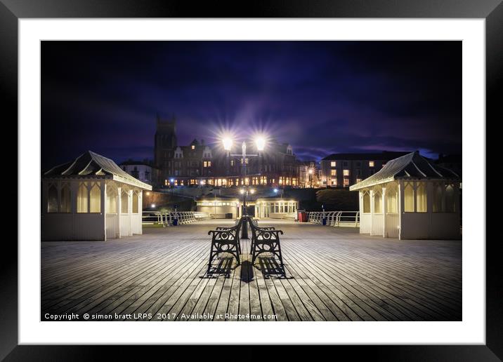 Cromer pier Norfolk at night looking towards town Framed Mounted Print by Simon Bratt LRPS