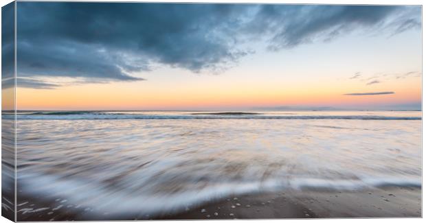 Ebb and Flow at Bamburgh Canvas Print by Naylor's Photography