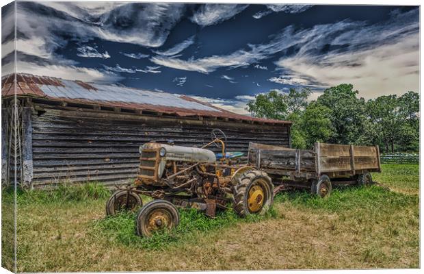 Old Tractor by Barn Canvas Print by Darryl Brooks