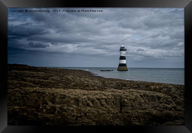 Storm Clouds Over The Trwyn Du Lighthouse Framed Print by rawshutterbug 