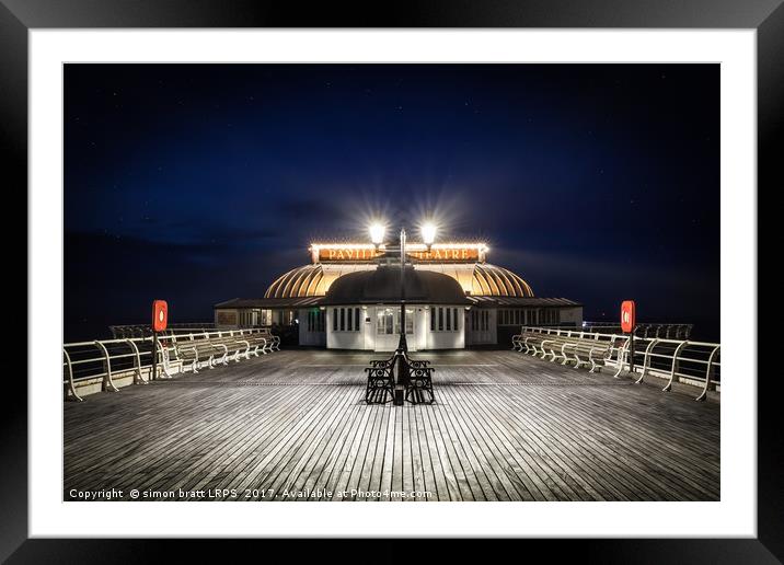 Cromer pier pavilion at night in Norfolk Framed Mounted Print by Simon Bratt LRPS