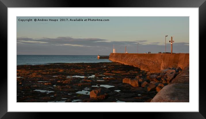 Seahouses harbour sunset song on wall. Framed Mounted Print by Andrew Heaps
