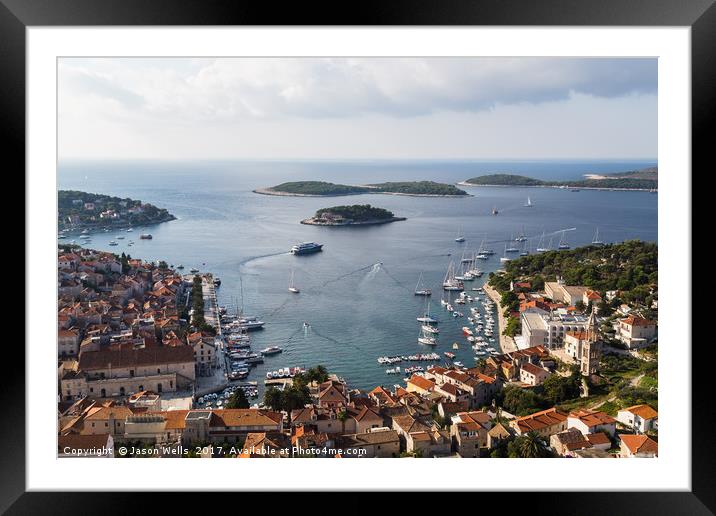 Yacht-dotted inlet of Hvar old town Framed Mounted Print by Jason Wells