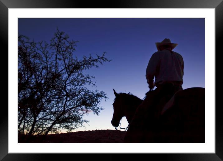 Cowboy on horse at daybreak Framed Mounted Print by Luc Novovitch