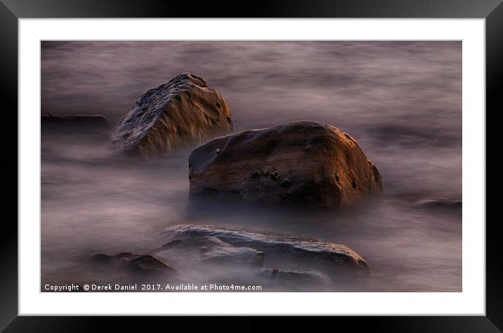 Moving water around rocks in Kimmeridge Bay Framed Mounted Print by Derek Daniel