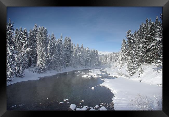 Icy River in Banff Framed Print by Pete Hemington