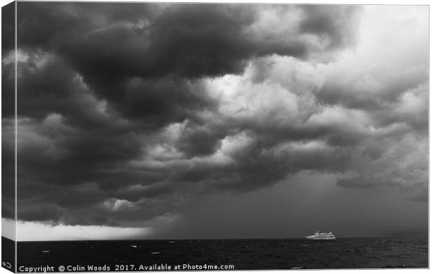 Boat and Approaching Storm Canvas Print by Colin Woods