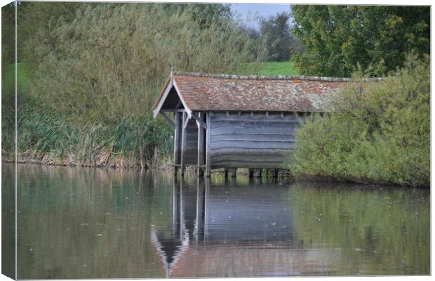 Tranquil Boathouse Canvas Print by Simon Hackett