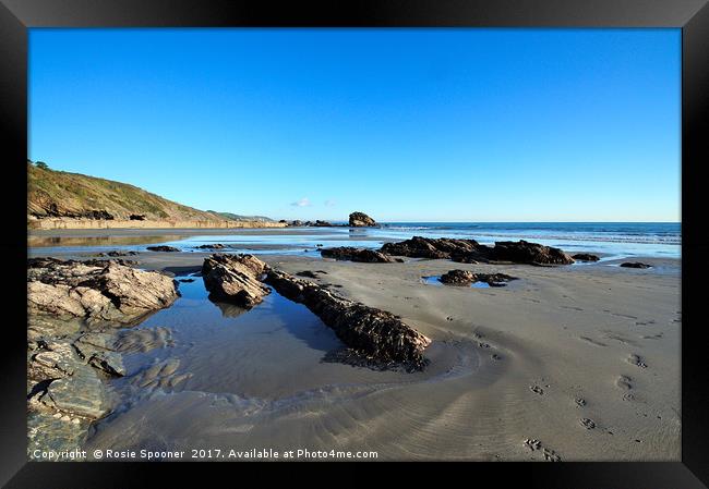 Millendreath Beach and Black Rock at low tide Framed Print by Rosie Spooner