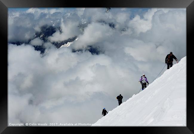 Climbers high in the Swiss Alps, on the traverse o Framed Print by Colin Woods