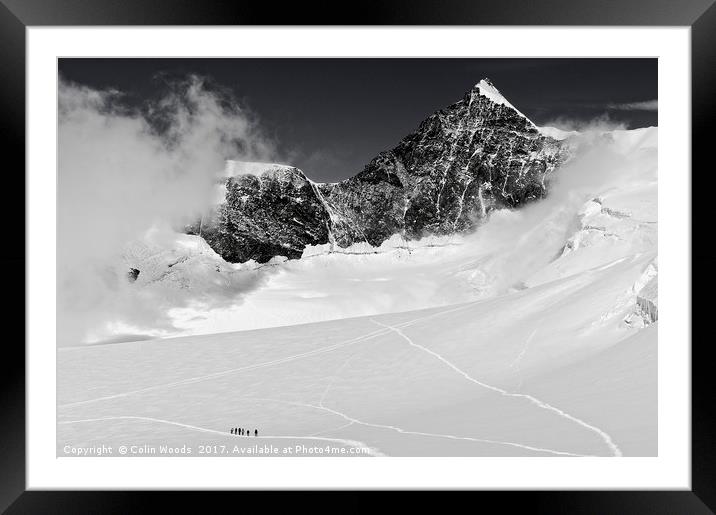 Climbers high in the Swiss Alps, on the traverse o Framed Mounted Print by Colin Woods