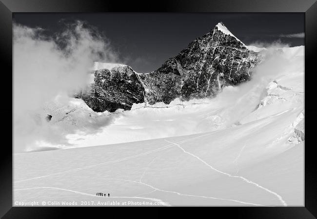 Climbers high in the Swiss Alps, on the traverse o Framed Print by Colin Woods